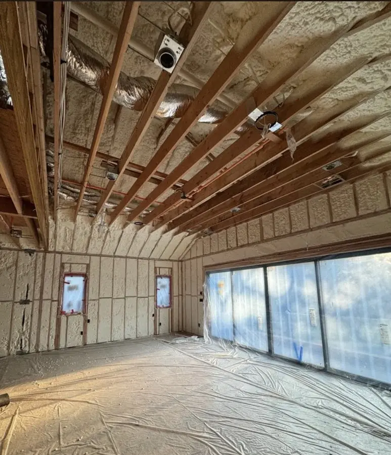 Interior walls and ceiling insulated with spray foam during new construction in South Miami Heights